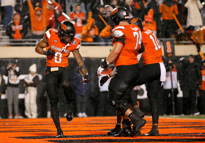 Oklahoma State Cowboys running back Ollie Gordon II strikes the Heisman pose after a touchdown against the BYU Cougars.